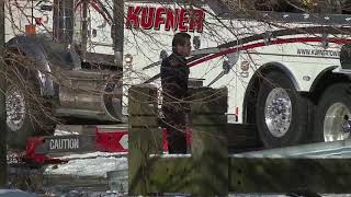 Crews gather to pull car from Cuyahoga River