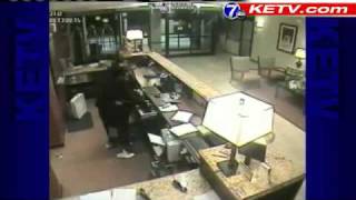 Man Holds Gun To Hotel Clerk's Head