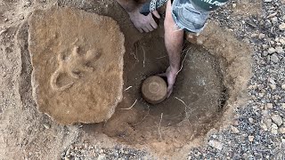 We found a treasure urn filled with Roman coins under a rock cover while metal detecting