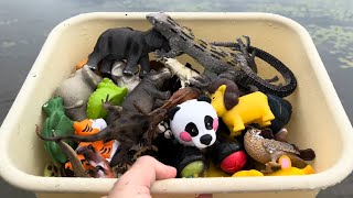 Box filled with various Zoo Animal Toys