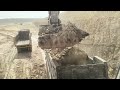 Powerful excavator loading Volvo dumper machine big machine poklen caterpillar 777