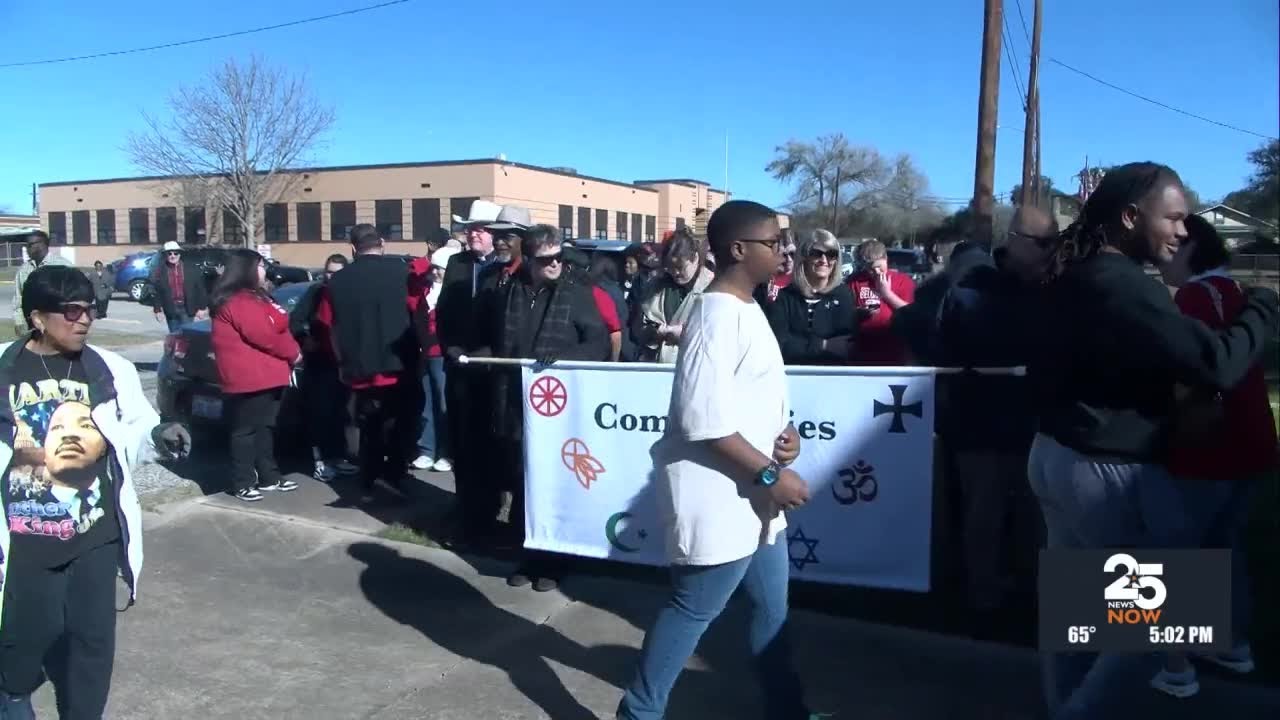 Community members gather for the MLK march from Palestine Missionary Baptist Church to Bethlehem