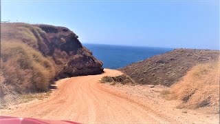 driving down a hill in santorini