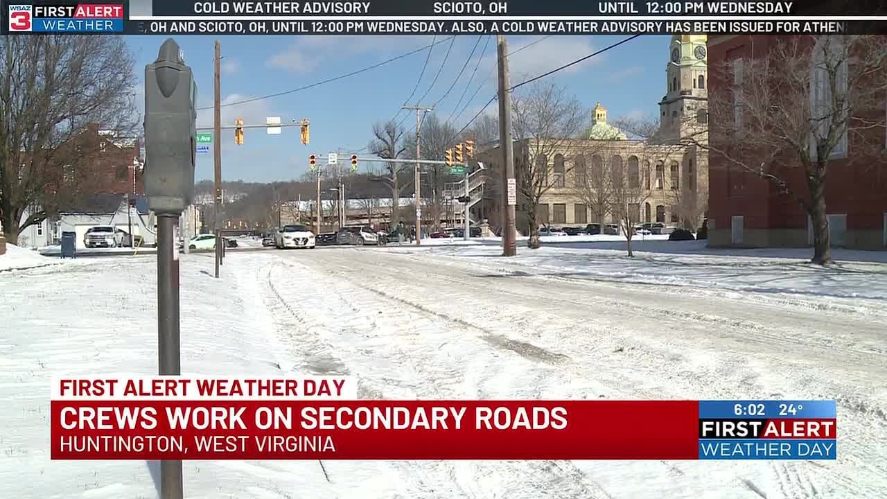 Crews work on secondary roads in Huntington - YouTube