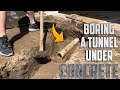 Tunneling Under a Concrete Footing for a Sewage Drain