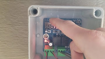 Setting the timer for an automatic chicken coop door (Amazon)
