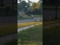 Cecelia biking on two wheels