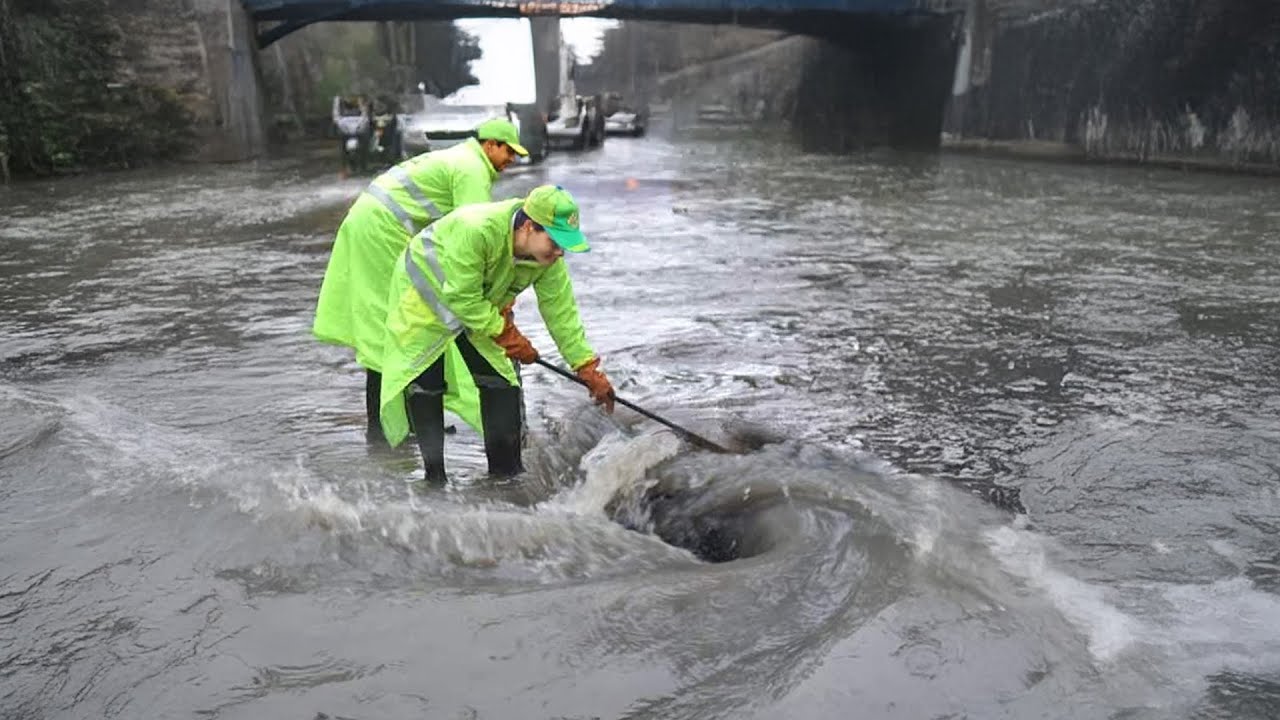 Draining Floods by Unclogging Blockages Clearing Drains to Battle ...