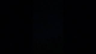 Strange looking light zooming across the night sky (terrible and shaky camera phone video... sorry)