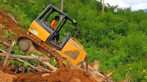 The CAT D5K XL Bulldozer Working over a Very Vulnerable Mountain