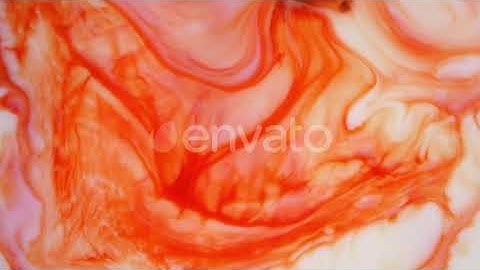 Footage. Ink in Water. Red and Orange Ink Reacting in Water Creating Abstract Background | Stock...