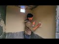 "Ali and Abu's joint project: rebuilding the bathroom wall with white cement"