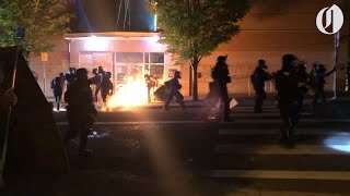 Protesters set fire outside Portland police precinct