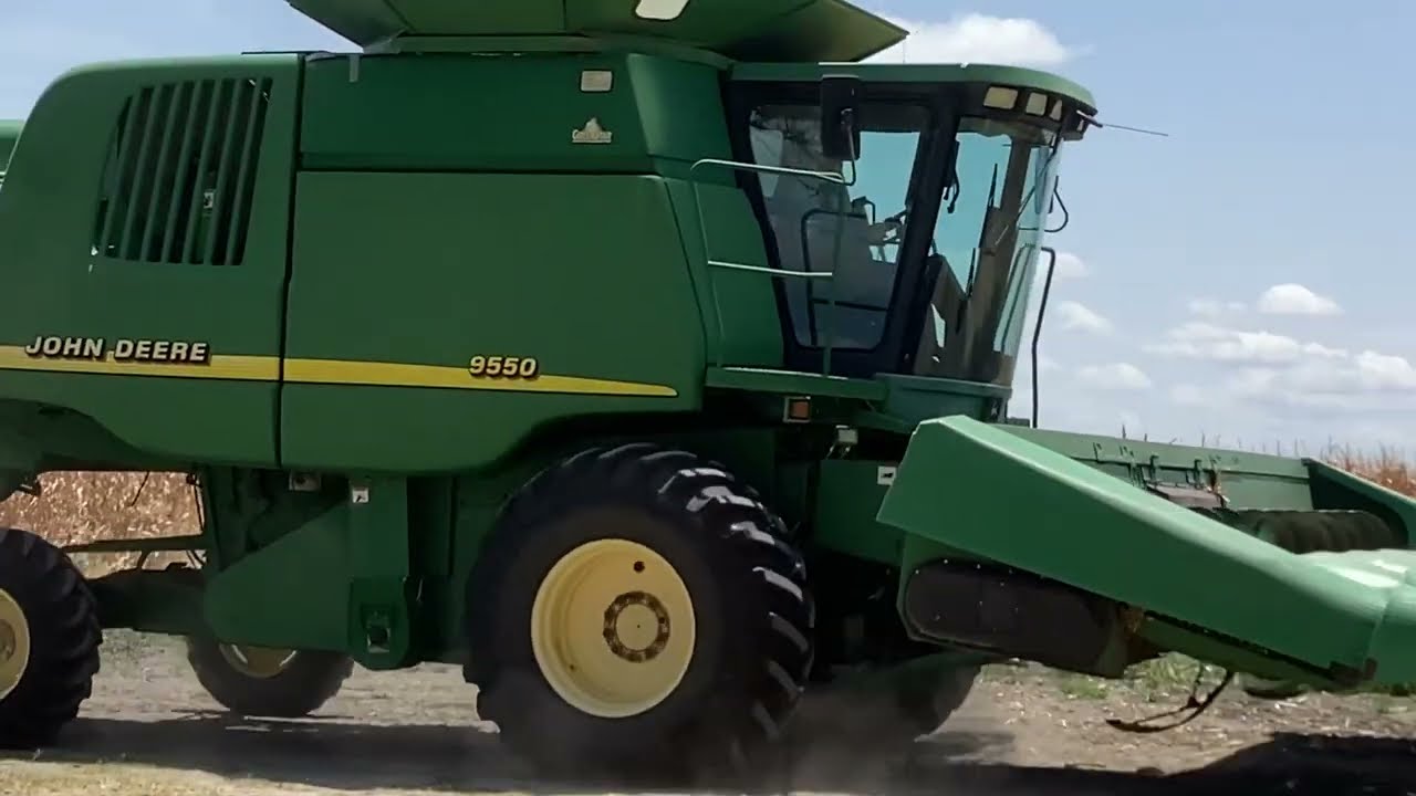 John Deere 9550 combine cutting corn