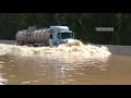 Trucks, Buses Crossing The Flooded Water And The Most Difficult Road