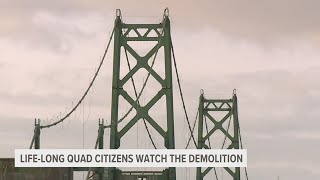 Community watches on as I-74 controlled demolition brings down remaining Iowa towers