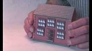 The House A simple sliding panel puzzle box that could be used as a money-box.