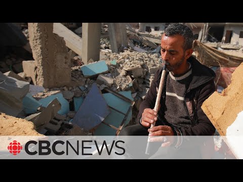 Palestinian flutist embraces music amid destruction in gaza