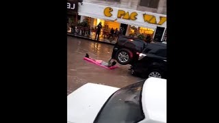 Guy Hilariously Chilling On A Floatie While Being Dragged By A Car In Rain Water