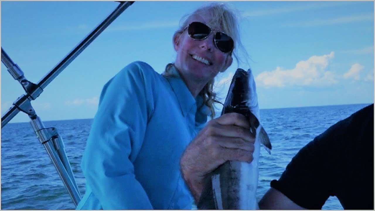 A Man Took A Picture Of His Wife On Their Boat. Then He Spotted Something Floating In The Ocean