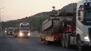 Israel moves armored vehicles along border with Lebanon as anti-air system knocks out projectiles