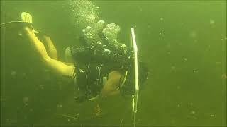 Woman Scuba Diver Explores Underwater Base