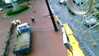 Taking down the Christmas lights on George Square in Glasgow.