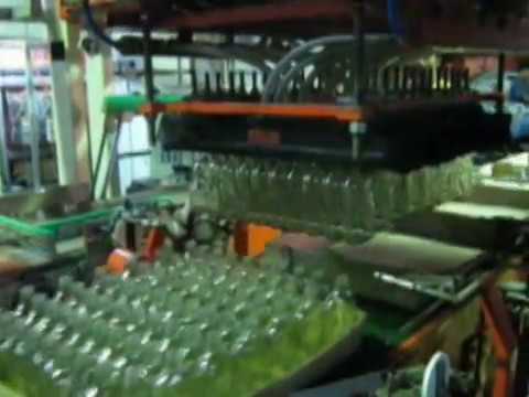 automatic stacking cum pic&place machine for non-round bottles.mpg