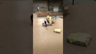 Scooter rider attempts backflip from ramp at skatepark and lands on his head