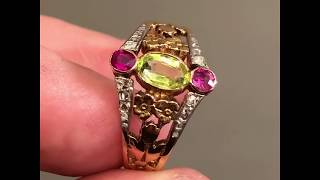 Antique peridot, ruby and diamond ring with floral engravings, circa 1900