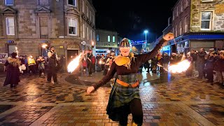 PyroCeltica fire juggling through streets of Inverness in Hogmanay parade to Red Hot Highland Fling