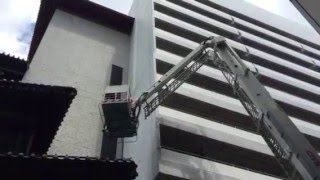 SCDF hosing down the affected rooftop area at 11:45am