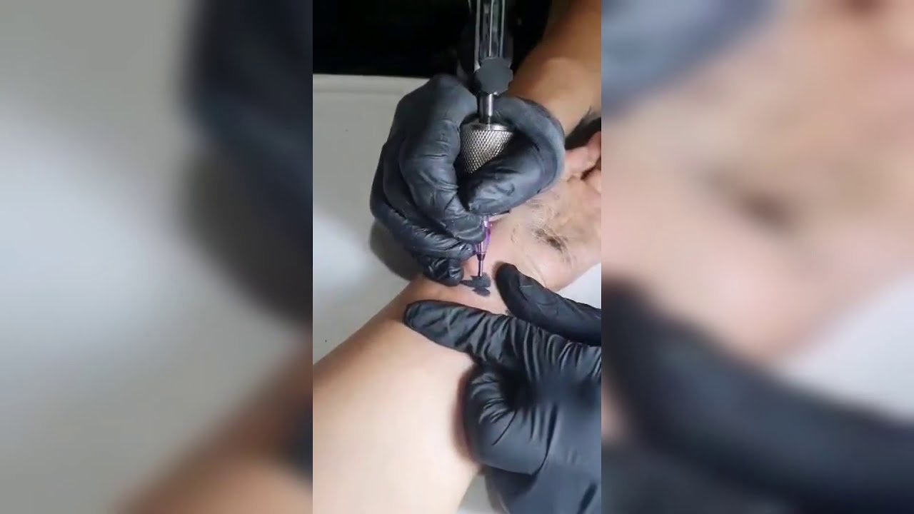 Micro Tattoo tribute to her mom who just passed away.