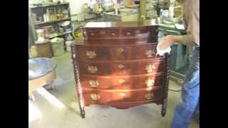 Tom Johnson of Thomas Johnson Antique Furniture Restoration in Gorham, Maine performs several repairs on an antique bow-front 