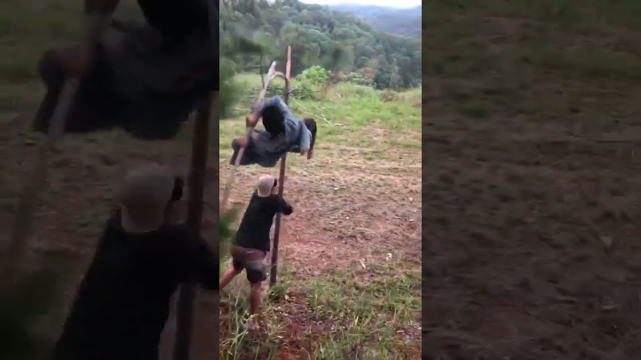 Guy attempts to use tree as a slingshot but tree snap and he falls on the ground