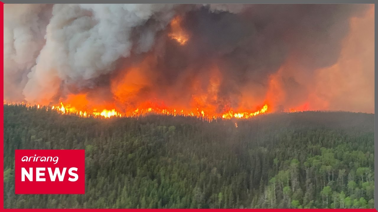 Thousands Evacuate in Canada as Wildfires Rage - YouTube