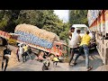 Shocking moment reckless car driver collides with heavy loaded trucks fuel tank on ghat road turn