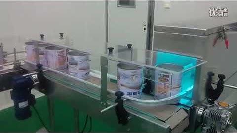 Magnetic conveyor cleaning and UV sterilizer tunnel for cans