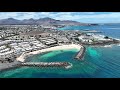 Lanzarote  playa flamingo and the maritime promenade in playa blanca in 4k  aerial view