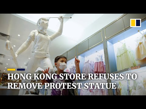 Hong Kong store owner rejects order to take down pro-democracy protest statue