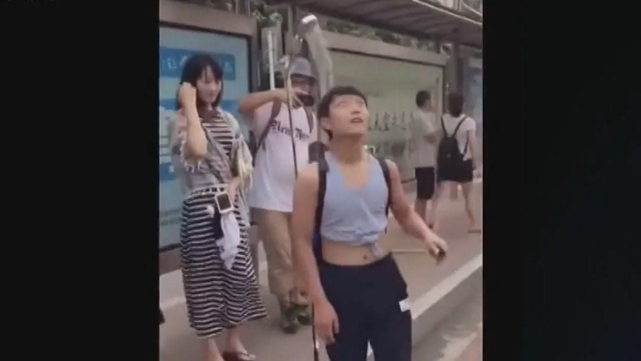 Chinese Man Keeps Cool in The Street with Portable Shower YouTube