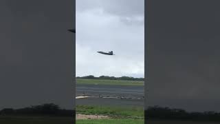 F-22s taking off from Honolulu on training flight