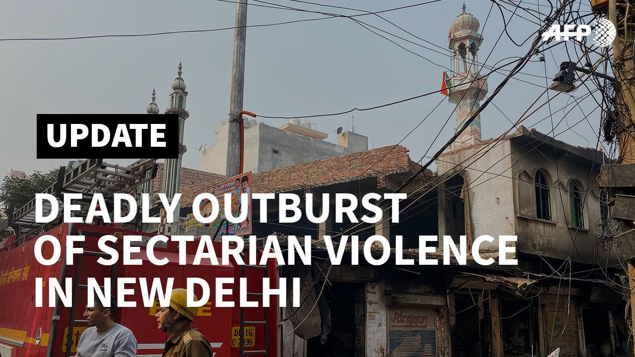 Police block roads in New Delhi as sectarian violence kills 13 | AFP