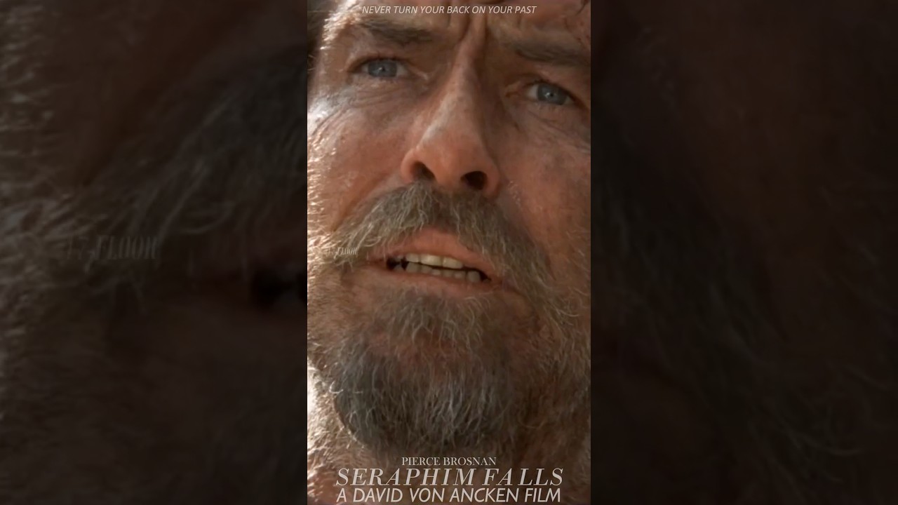 Pierce Brosnan.Ein Bösewicht zielt auf Pierce Brosnans Rücken. 