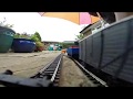 Hornby model train trip through garden
