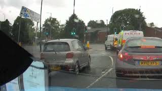 Cyclist runs a red light and is stopped by the police