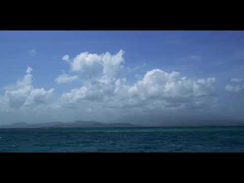 Sea Timelapse With Beautiful Cloud Moving On Waves With Mountains In Background In 4K
