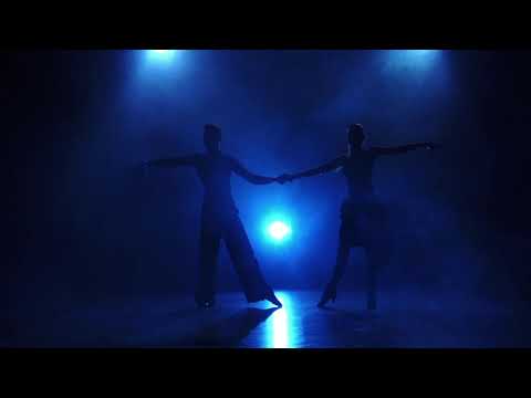 Silhouette Of Pair Dancers Performing Salsa Dance.