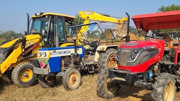 JCB 3DX Backhoe Loader Loading Red Mud In Mahindra And Swaraj Tractor Trolley For Road Construction