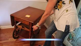 Anne discusses a tea cart that is in an upcoming auction.